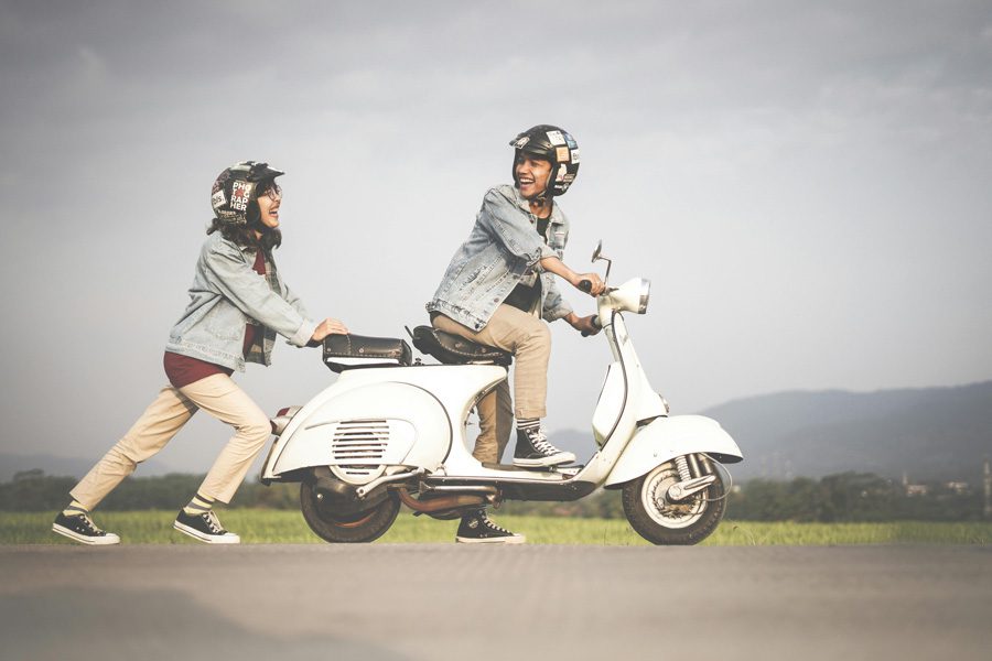 couple on moped to signify understanding a specific target market